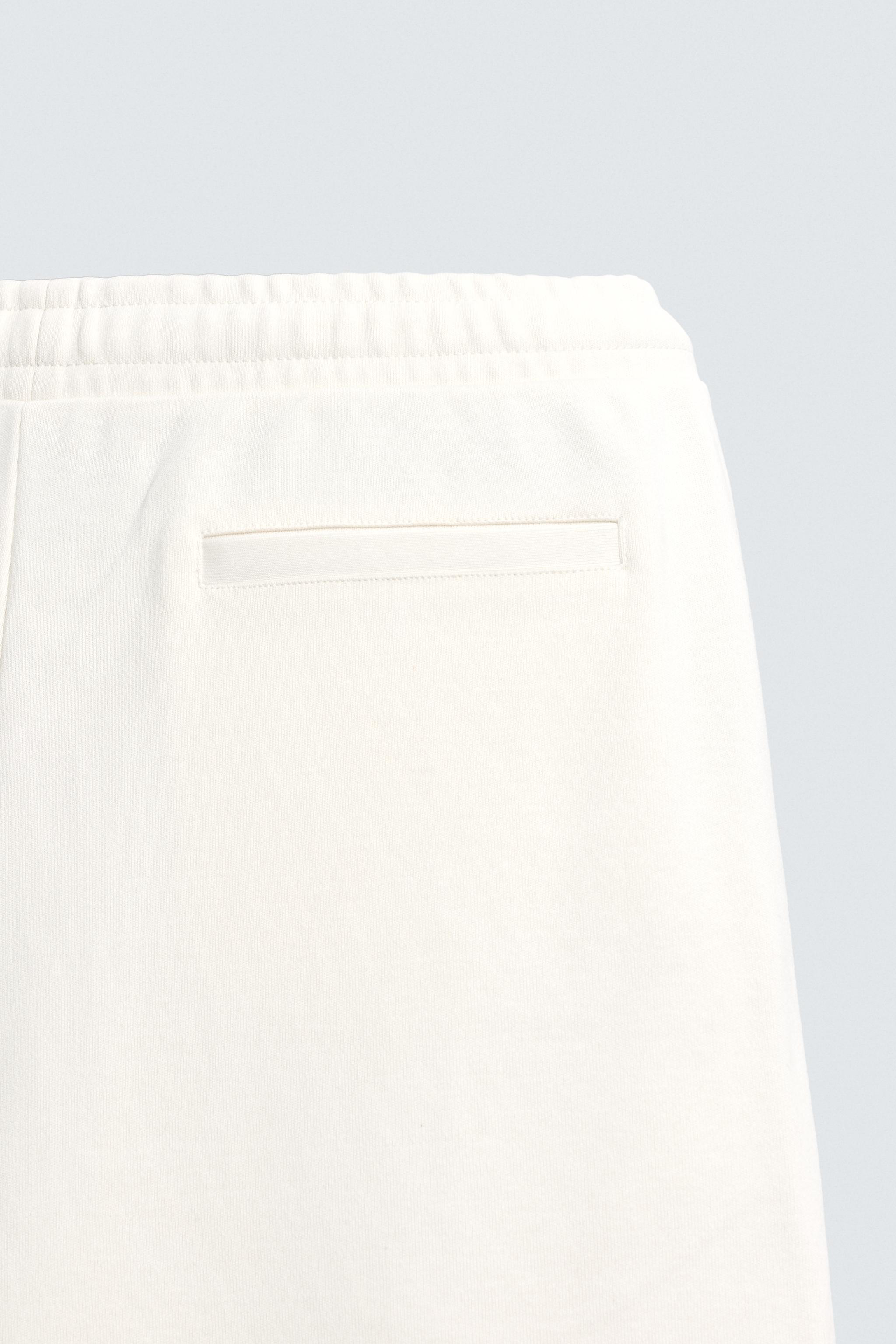 PLEATED WIDE FIT JOGGER PANTS